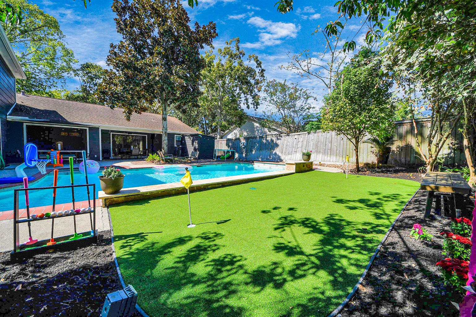 This home features great INDOOR/OUTDOOR Entertaining space - practice your putting, play some pool basketball, BBQ, play some billiards, arcade games, board games or whatever your heart desires! 