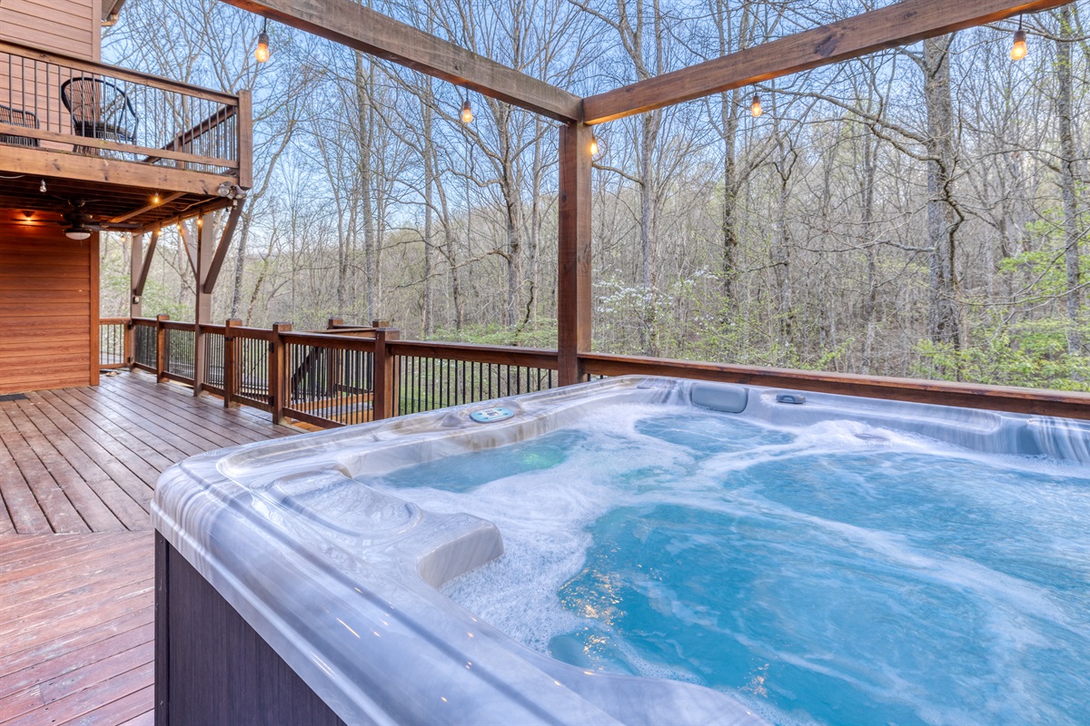 Soak and relax in the hot tub on the back deck