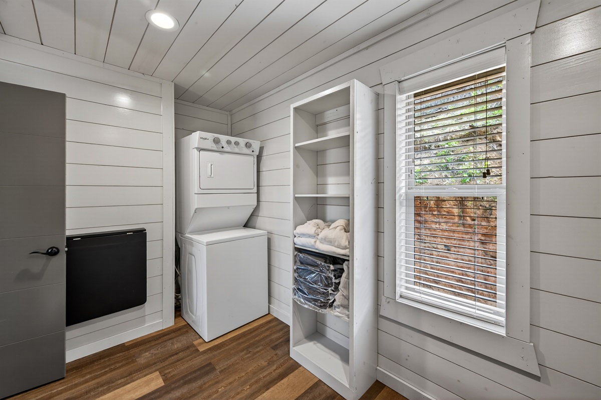 Walk-in closet with washer and dryer.