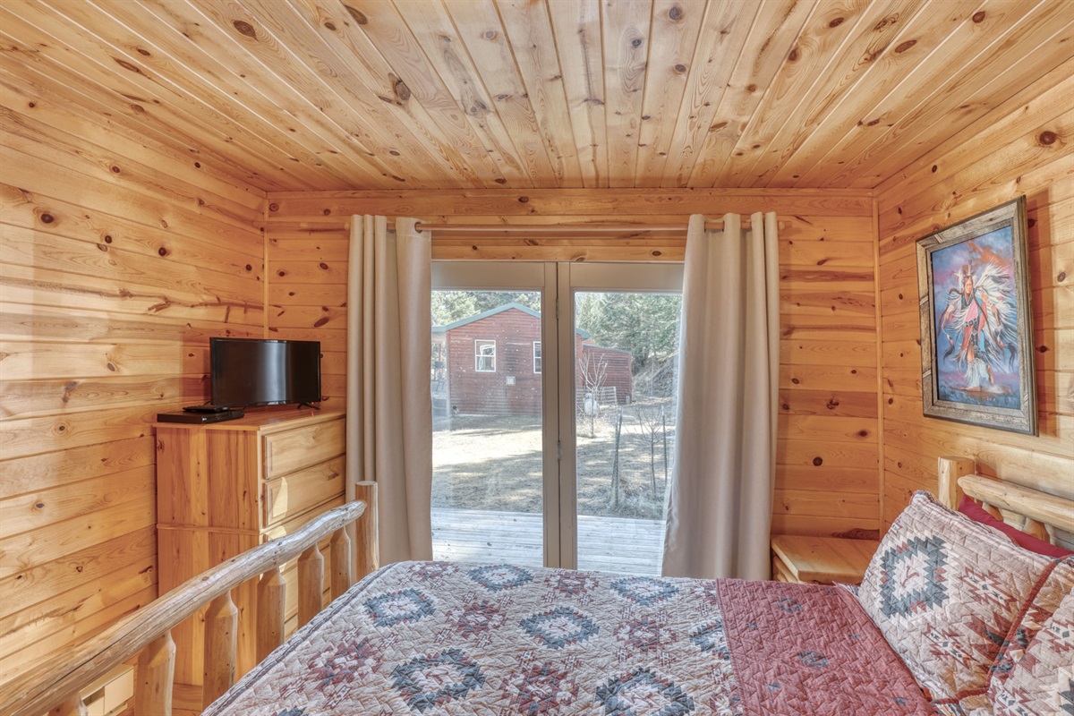 Bedroom 2 with queen bed and TV