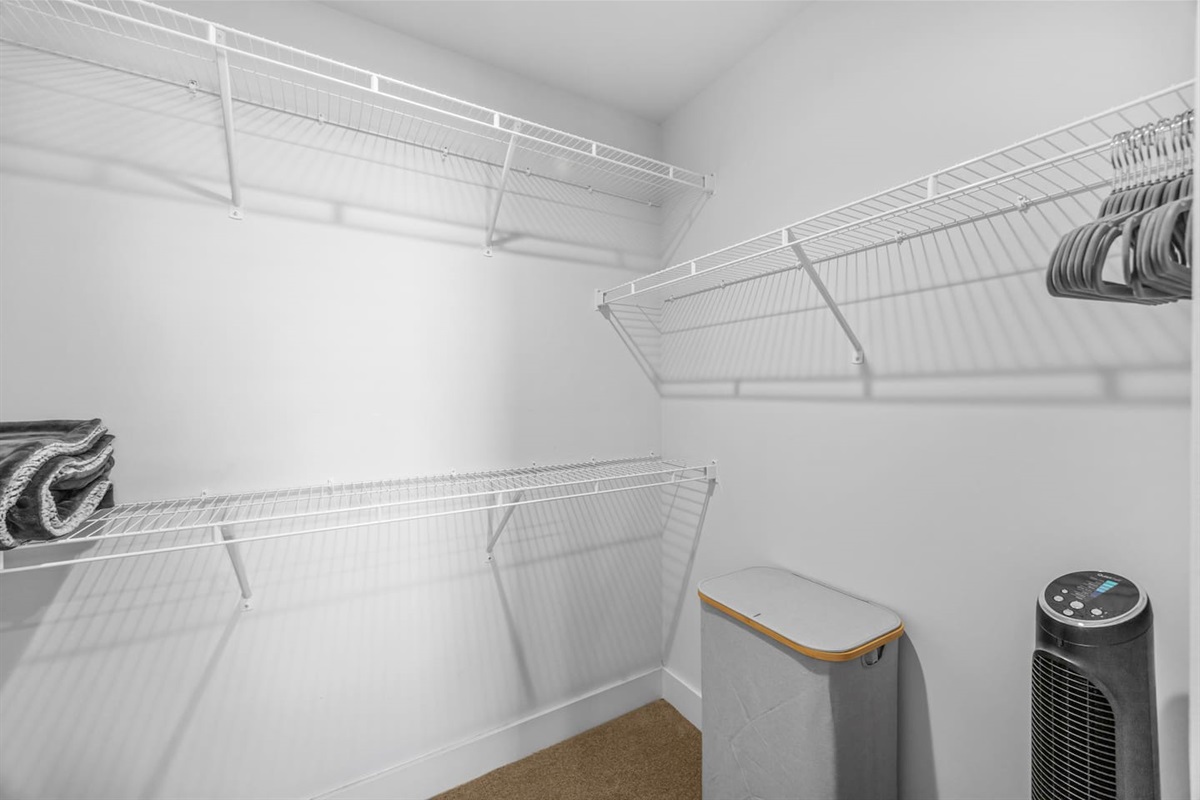 Ample storage space with shelving and hangers to keep your stay organized.