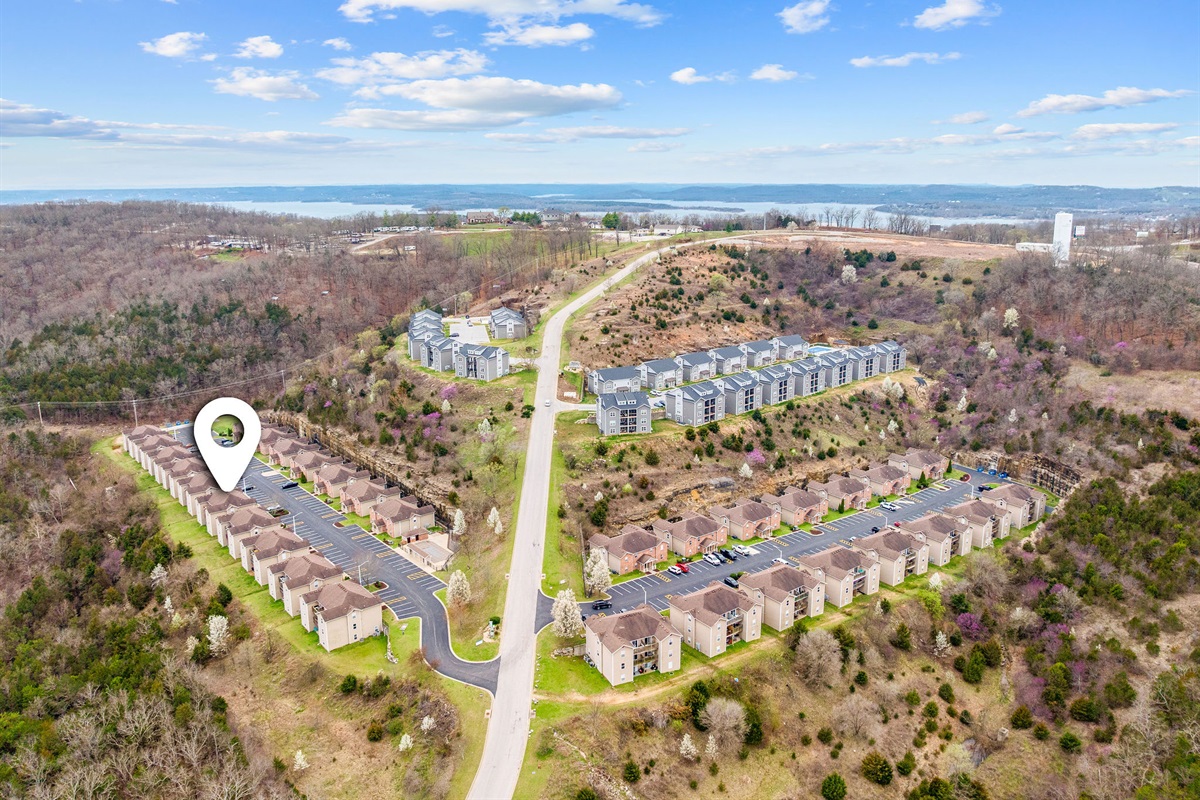 Community aerial overview with nearby lake