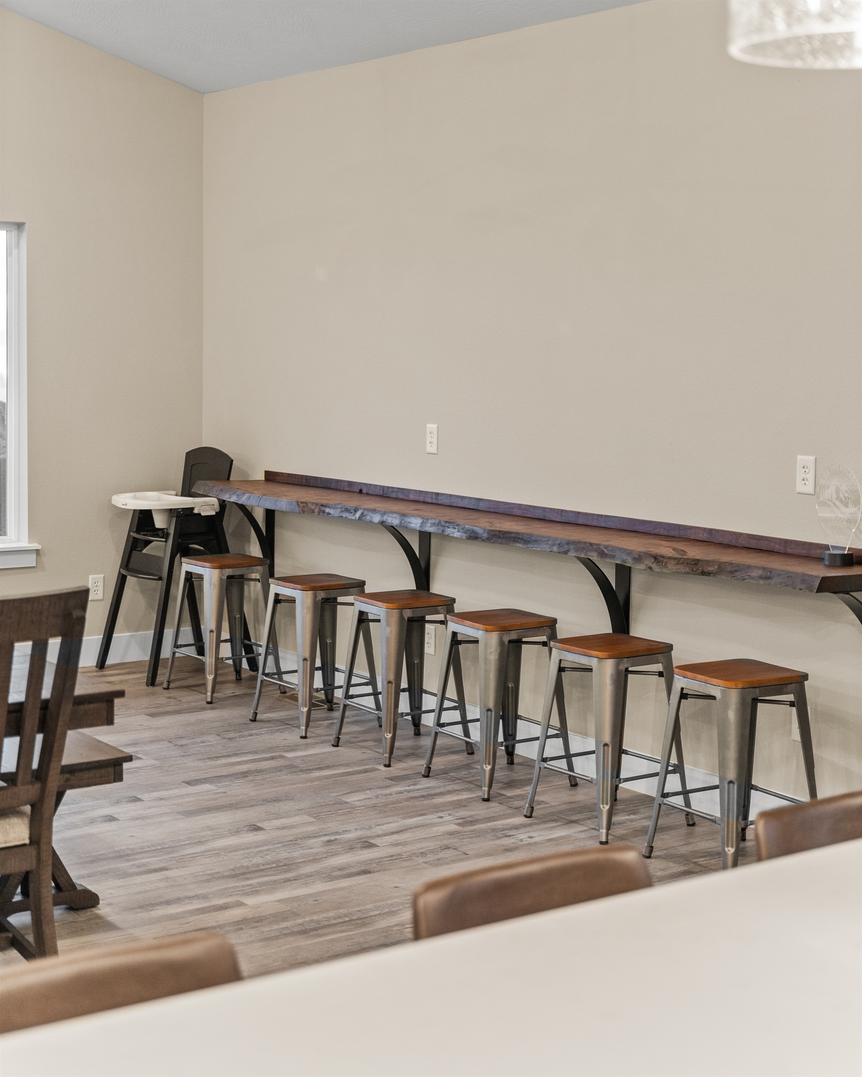 Dining Area also has a bar top along the wall for an additional six seats and a highchair if you have little ones.