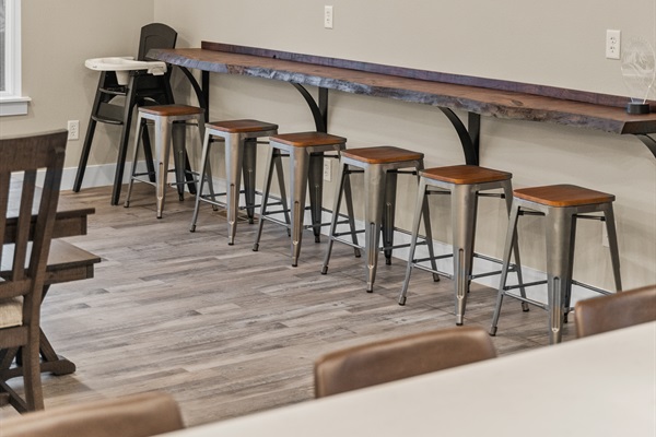 Dining Area also has a bar top along the wall for an additional six seats and a highchair if you have little ones.