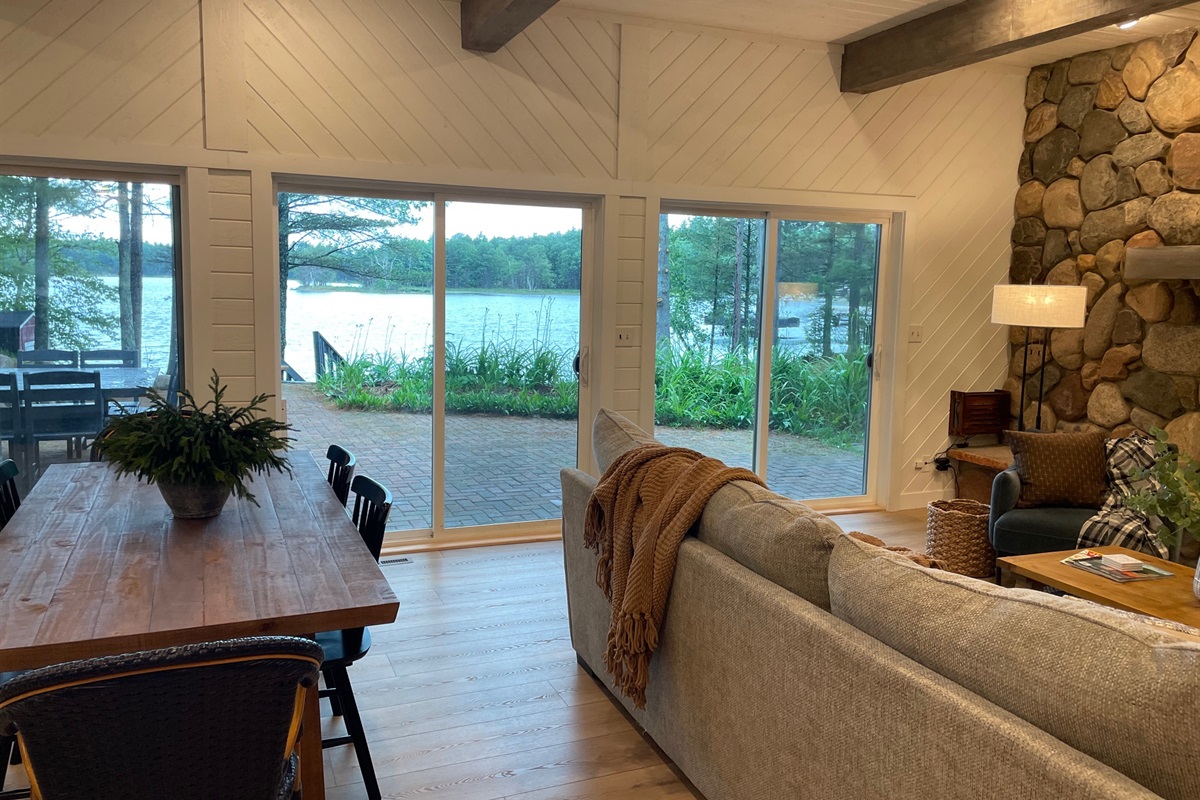 A wall of windows offers panoramic views of the lake