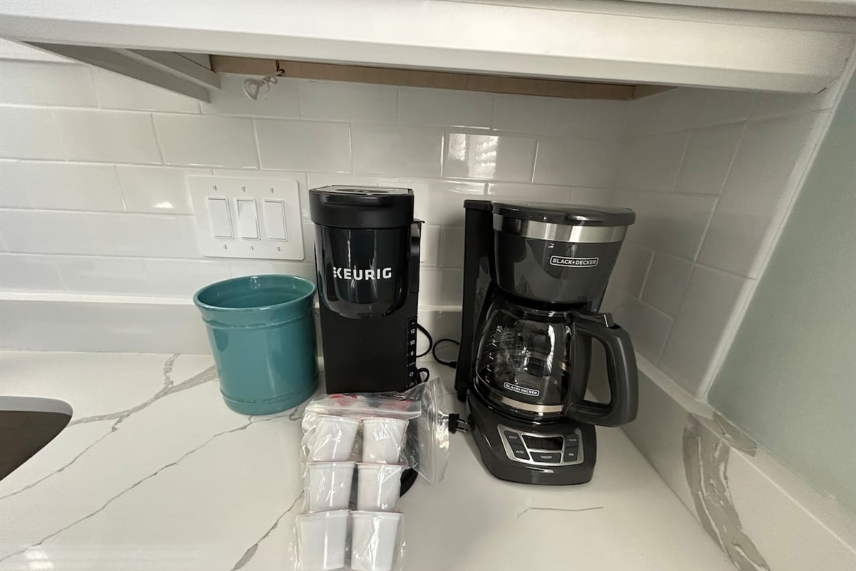 Keurig and drip coffee maker that includes some starter K-cups.