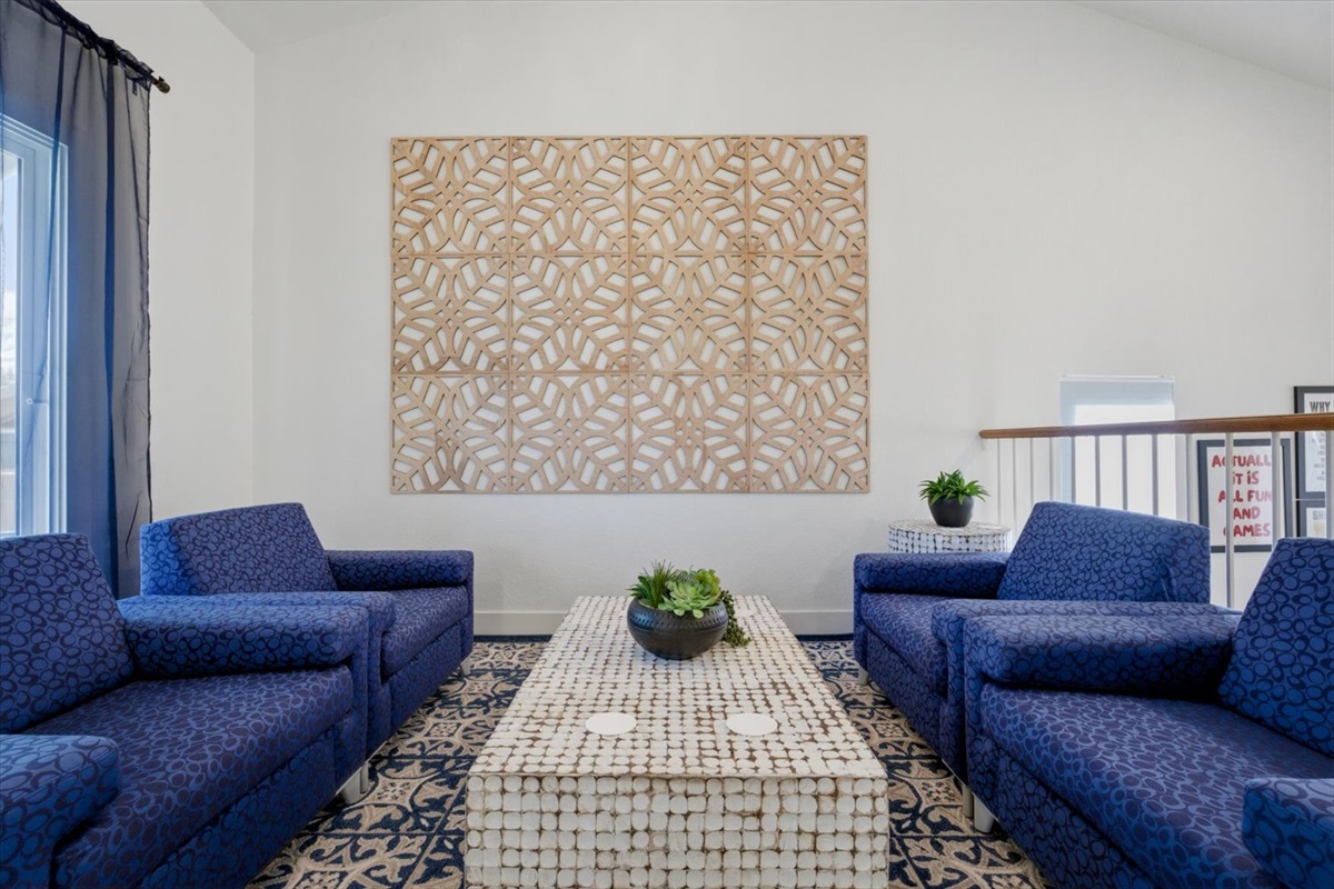 Just one of many gathering areas, this hip lounge overlooks the game room and connects to deck/balcony that overlooks the pool & fire pit.