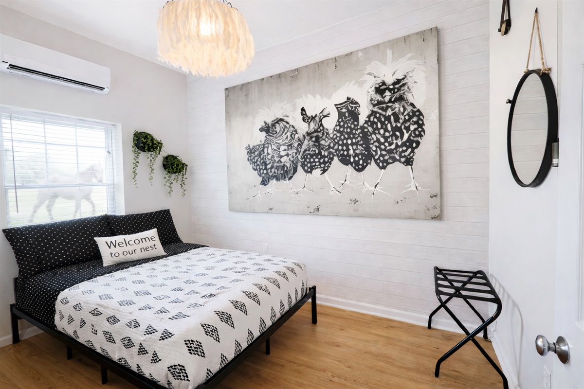 Second bedroom with a full-sized bed and a chicken theme