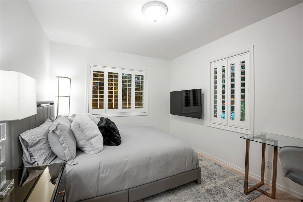Guest Bedroom: Queen bed, office desk + chair, 50" 4K TV.