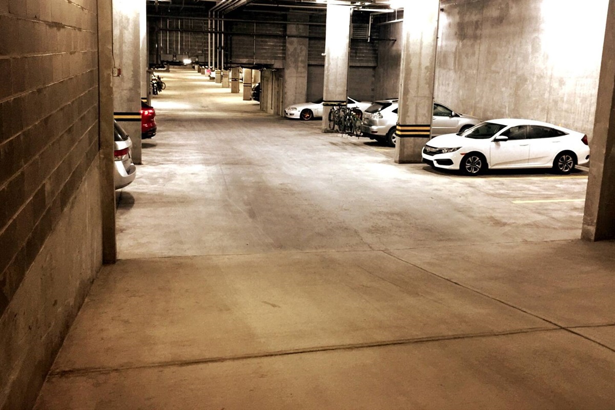 Heated parkade, free unassigned parking, card key access.  Take elevator to 3rd floor. 