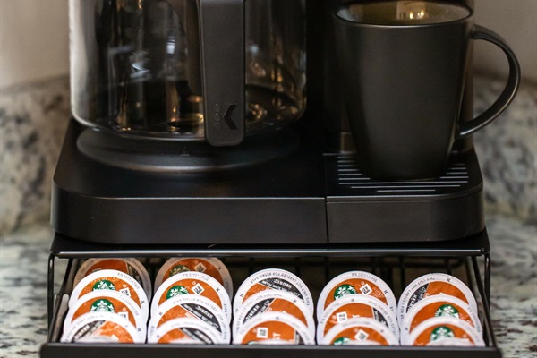 Coffee bar setup for K-cups or brewed coffee, including creamer