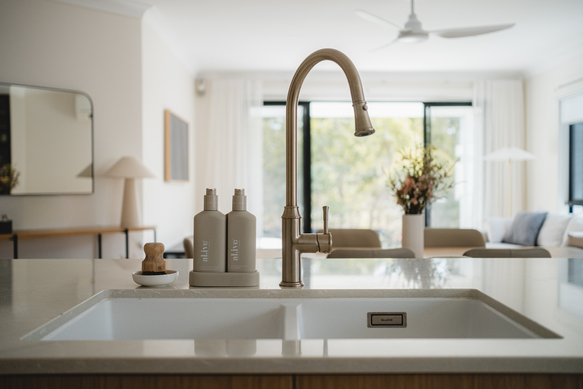 Enjoy the little details of this modern kitchen, with stylish finishes and a seamless connection to the dining and living areas.