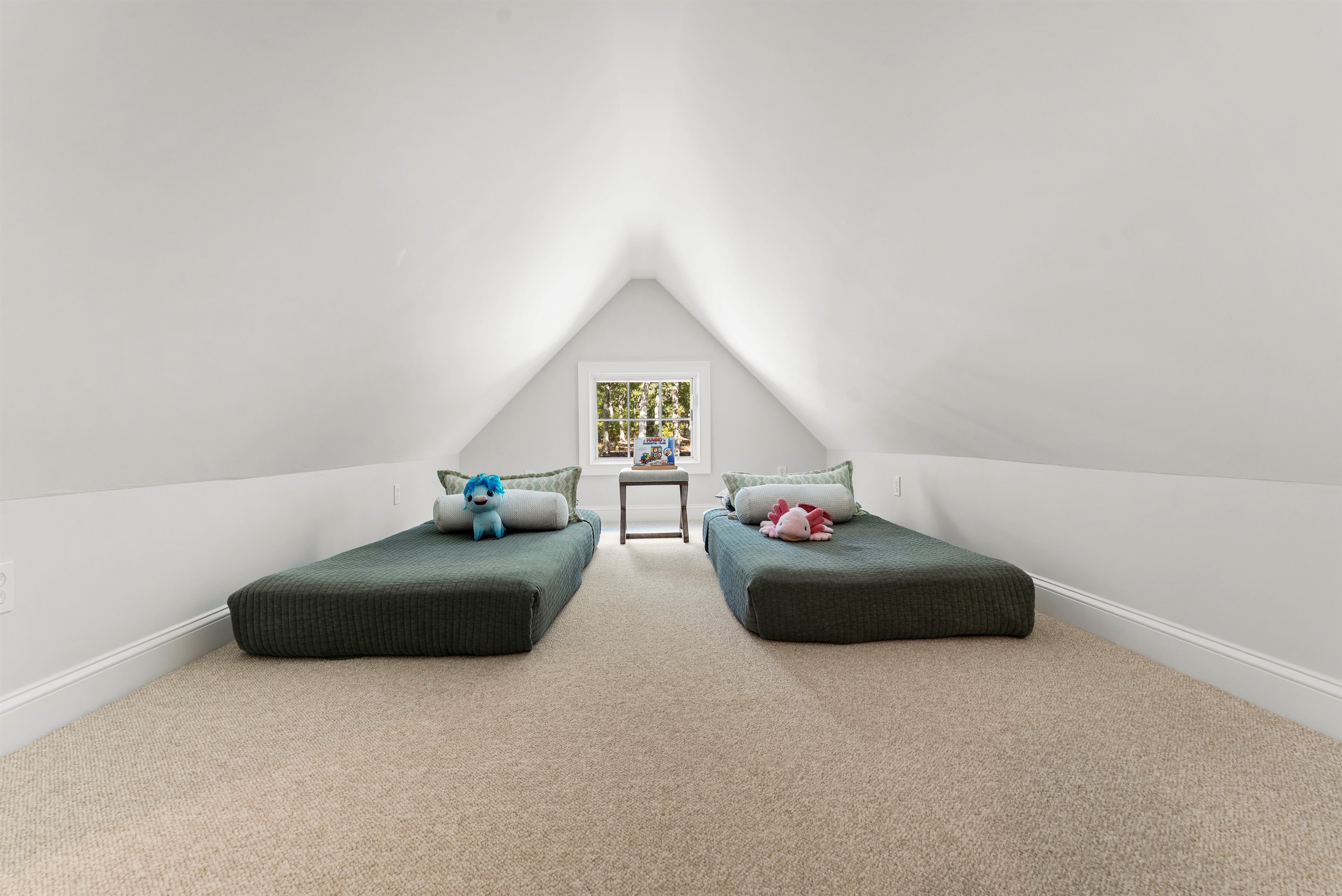 With a queen and two twin beds, this bedroom  offers space and flexibility for guests of all ages.