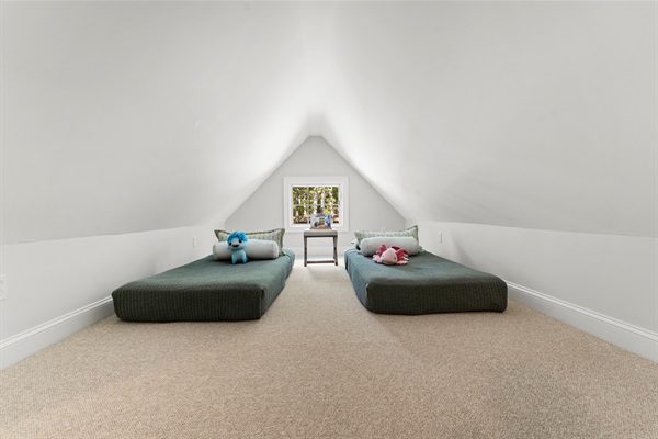 With a queen and two twin beds, this bedroom  offers space and flexibility for guests of all ages.