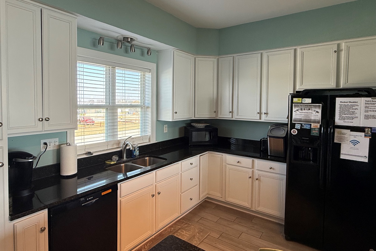 Fresh white cabinetry, granite countertops, nugget ice maker, Keurig and Drip Coffee Makers