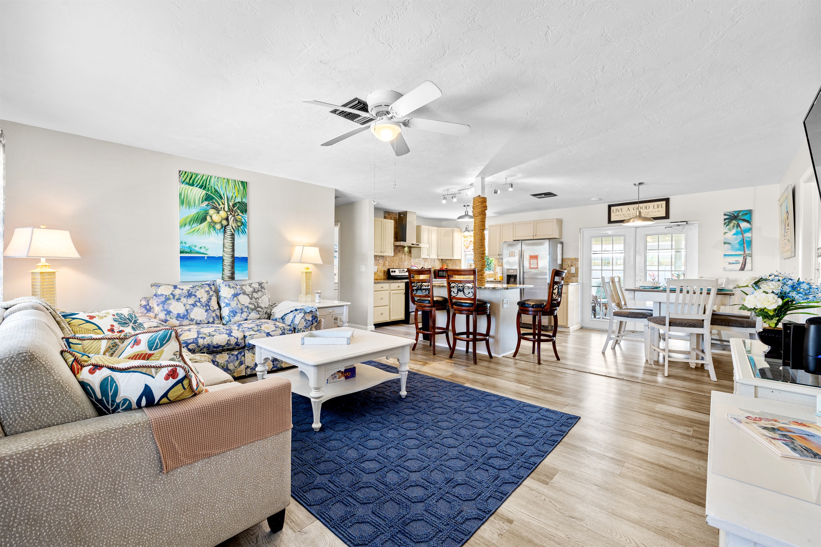 Open Concept Full View of Living room/Dining room and Kitchen/Bar area.