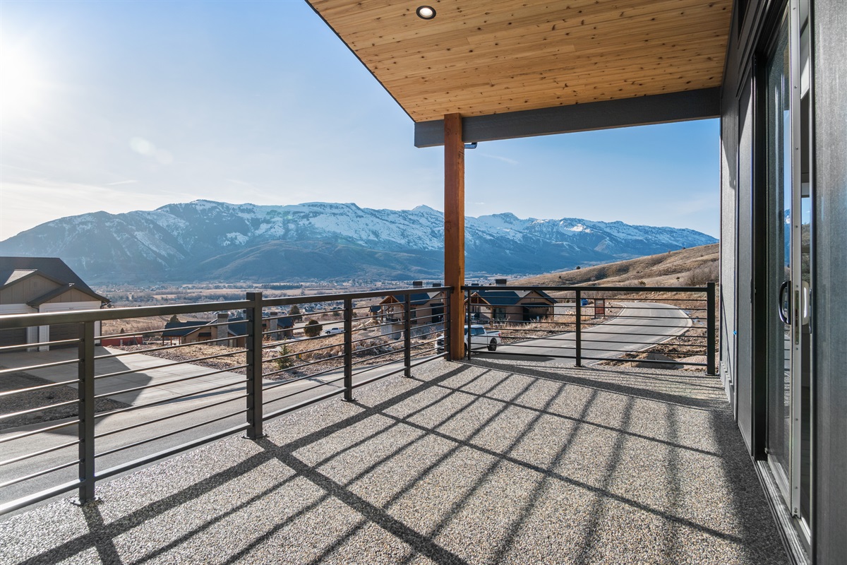 Private balcony with sweeping views of the surrounding peaks.