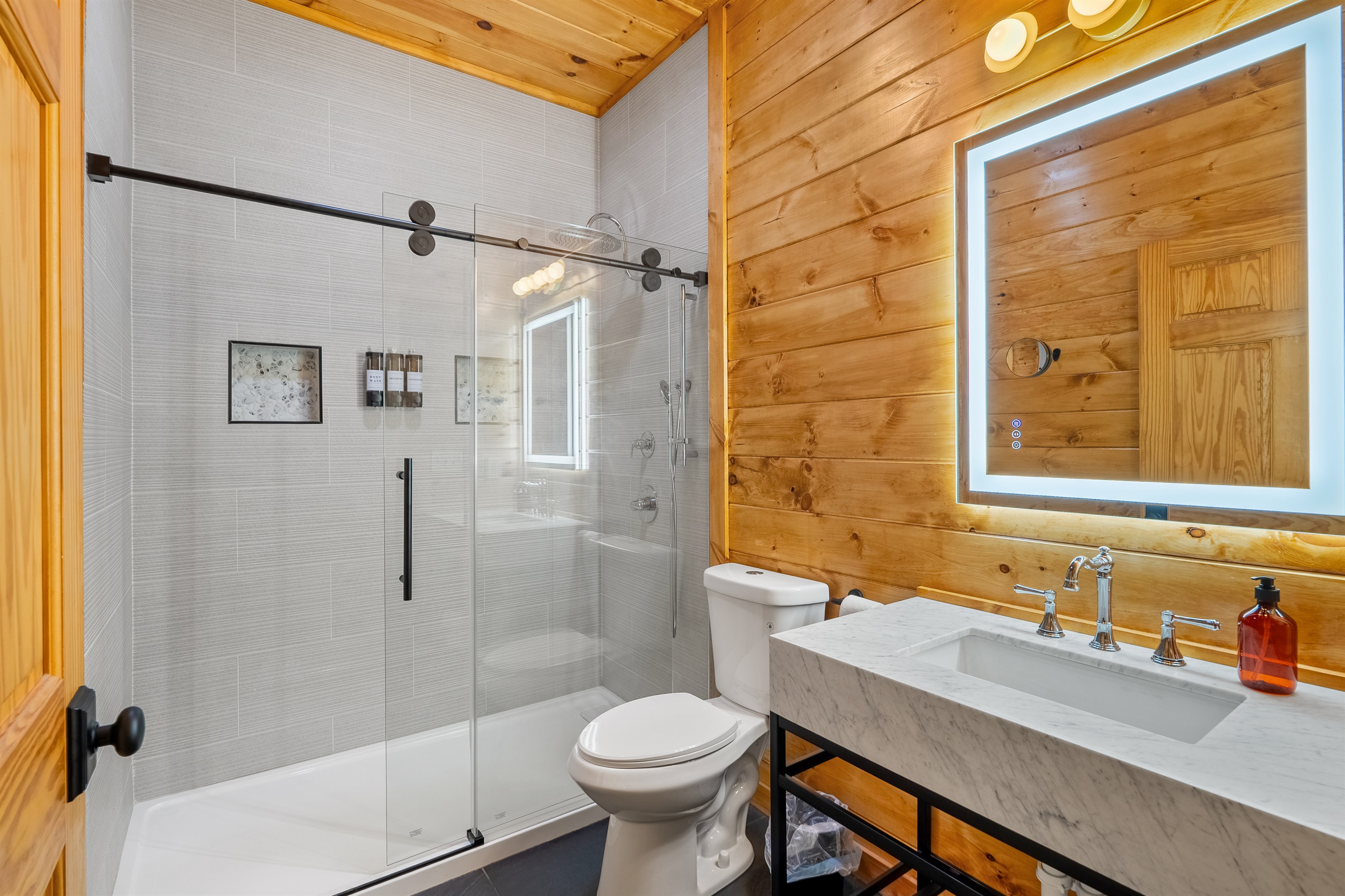 Enjoy the multiple shower heads in the newly renovated primary bath (Bedroom 1)