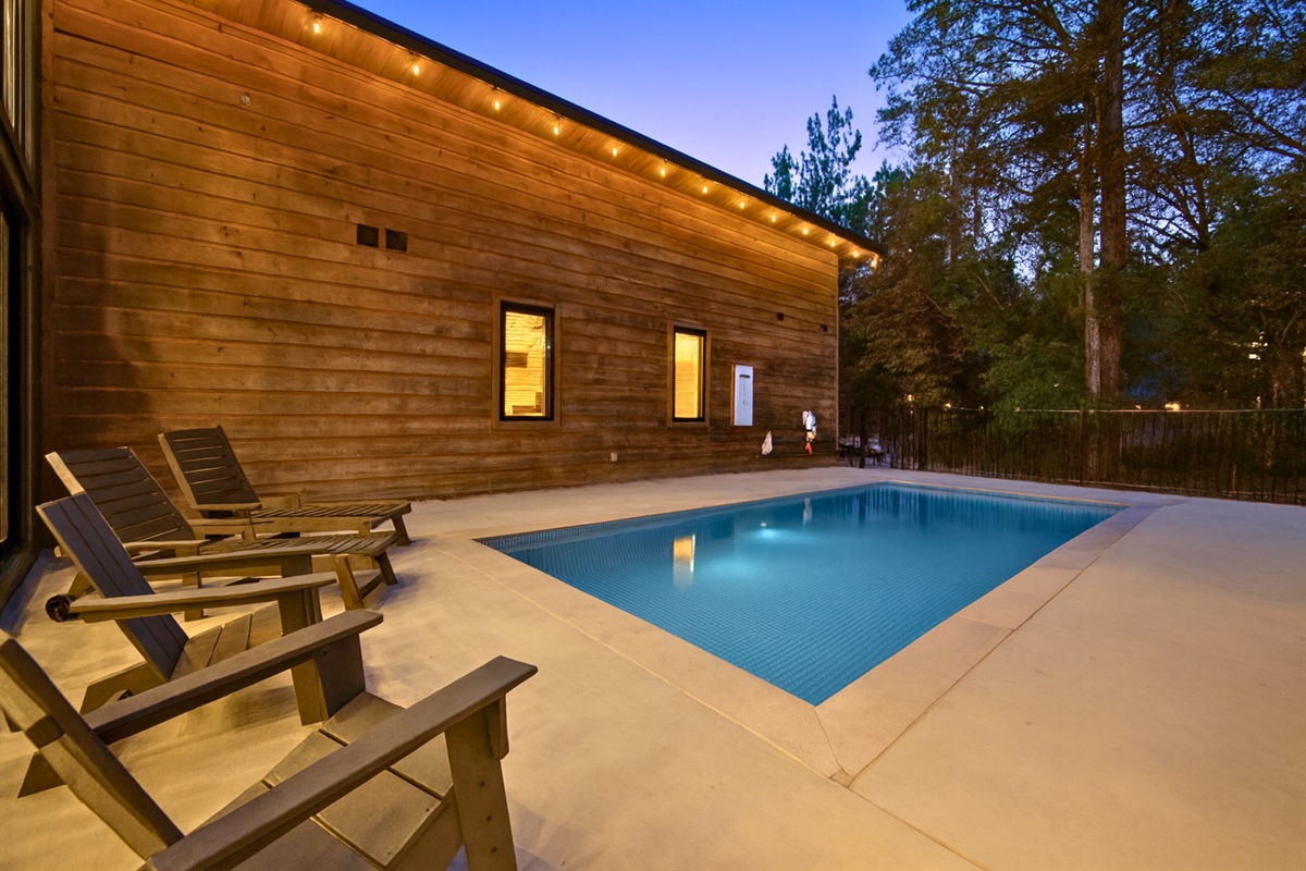 Bask in the peace of the pines and the sparkle of your own pool oasis.