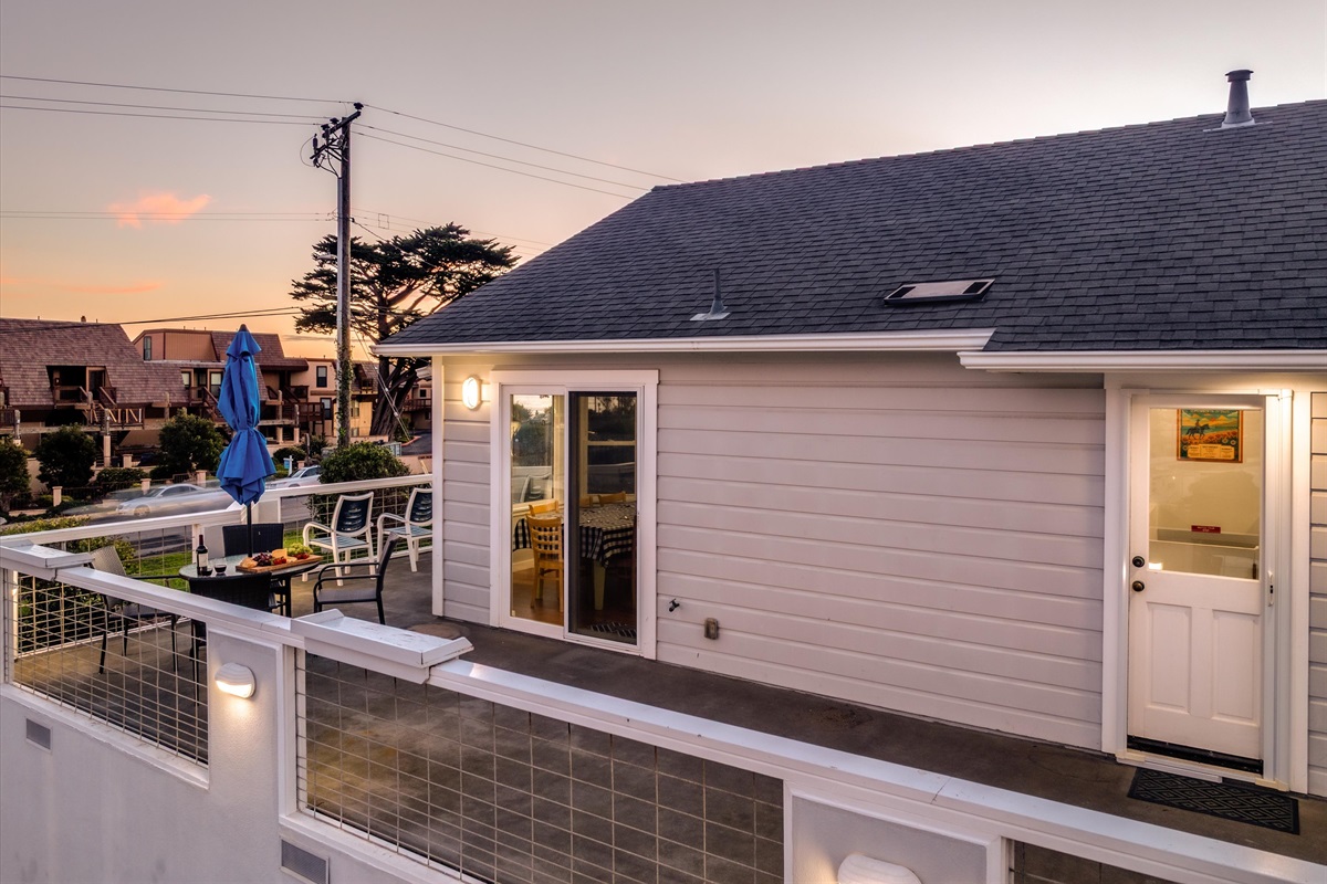 View of the spacious deck with plenty of chairs and dining table