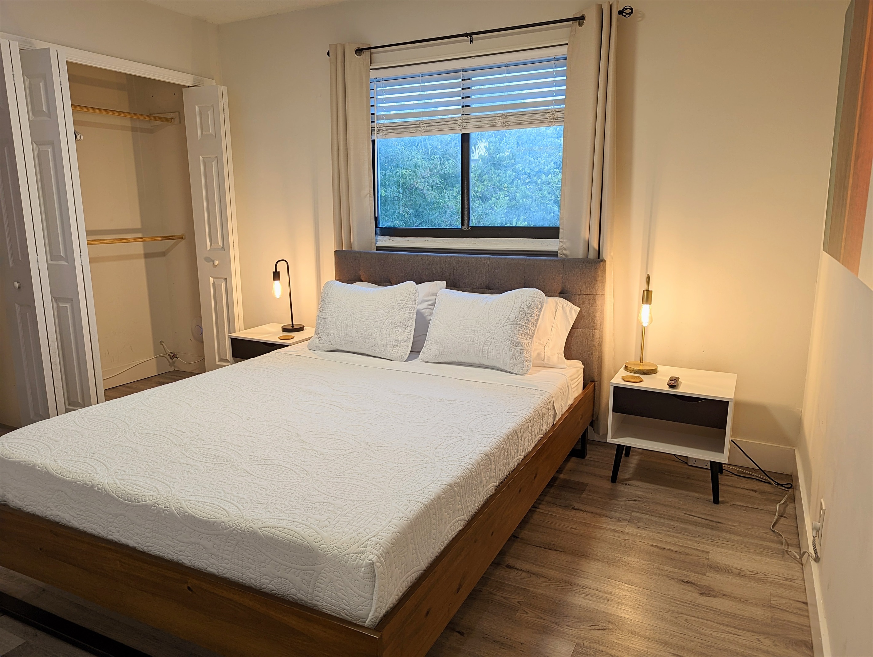 Guest bedroom includes ample closet space.