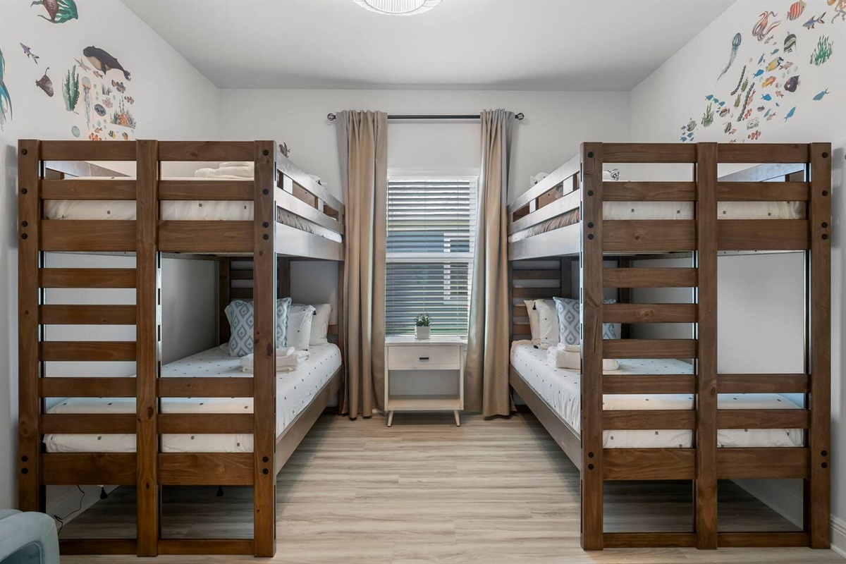 A cheerful retreat with bunk beds, arcade fun, and light-filled windows.