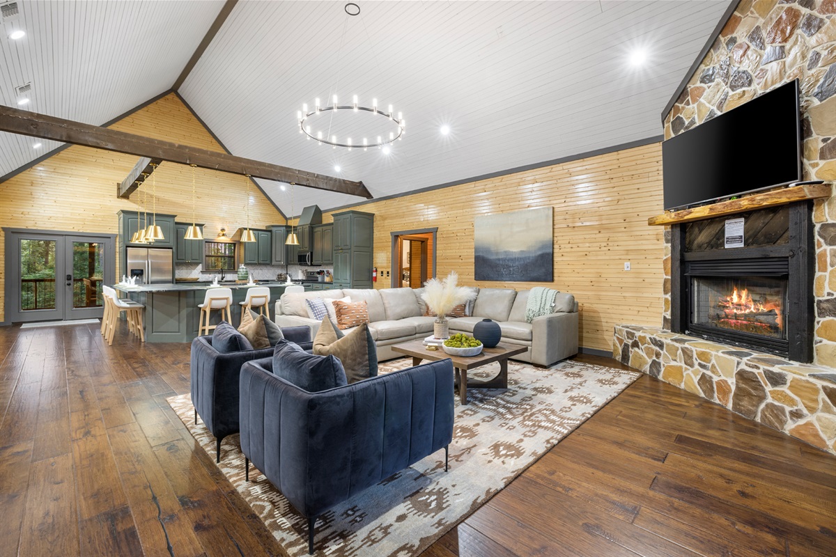 As you enter our cabin, you are greeted by soaring ceilings and spaciousness. Gather in the family room and kitchen for quality time with each other.