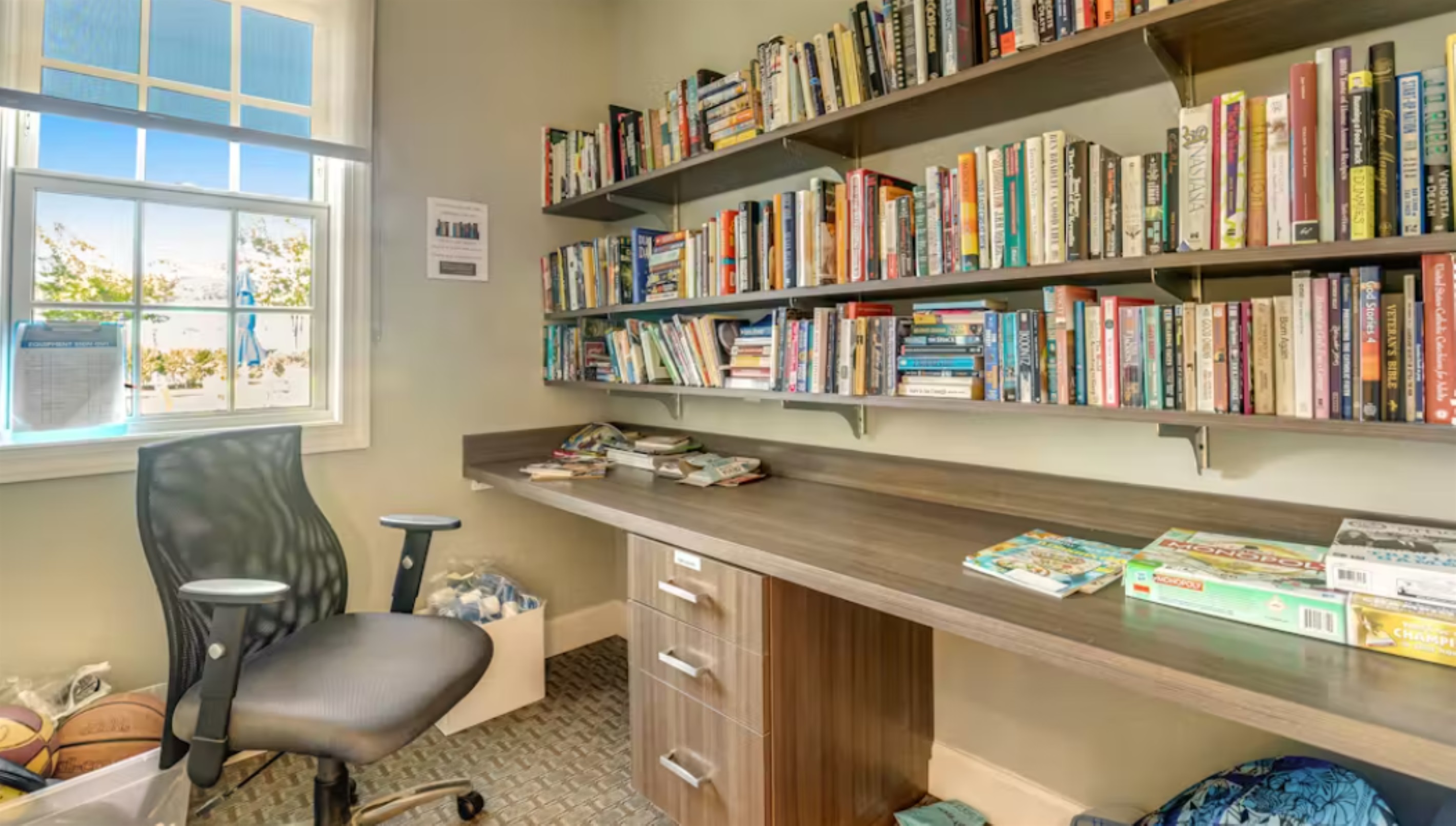 Cozy Library Nook: Discover our collection of books and board games tucked into a quiet corner—ideal for a rainy afternoon or unplugged family time.
