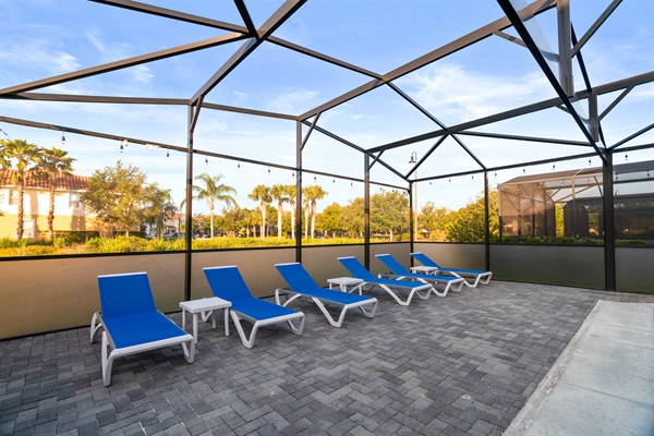 Unwind in your private retreat featuring an expanded pool with basketball hoop, six cushioned loungers, and a full outdoor dining area—perfect for both relaxation and entertaining.