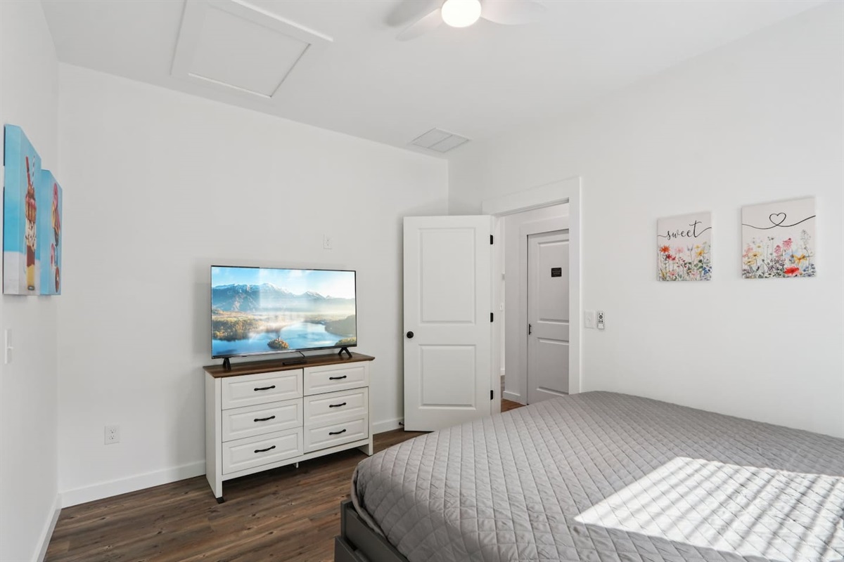 Primary Bedroom has King Bed with Twin Trundle underneath, pack n' play in closet, full en-suite bathroom, 2 closets, Smart TV
