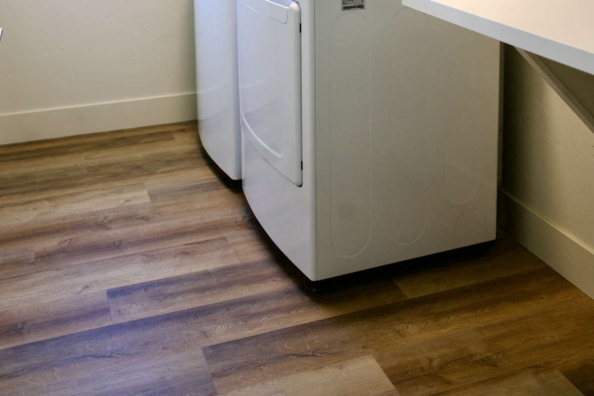 Upstairs, there is a spacious laundry room featuring a convenient folding table, providing added functionality and ease for longer stays.