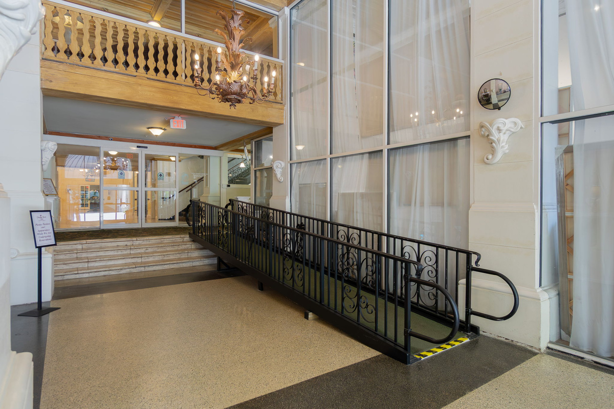 Ramp for wheel chair or luggage cart to main lobby.