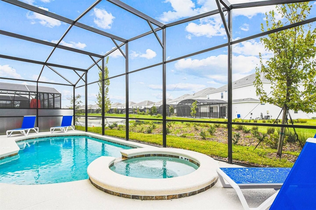 Relax and unwind by the sparkling pool and hot tub, the perfect oasis for a refreshing dip or a soothing soak