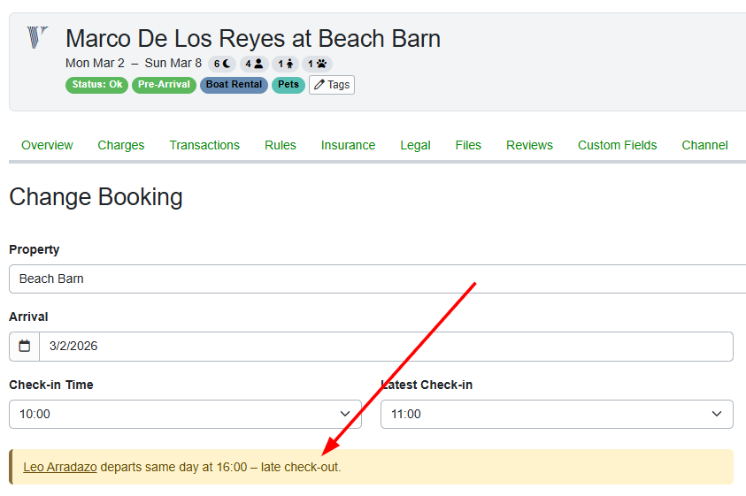If you change a booking with a potential overlapping changeover, the Change Booking page displays a pink warning banner indicating a conflicting check-in or check-out time for the guest name in the conflicting quote,&nbsp;and you can click the link to go to that booking.